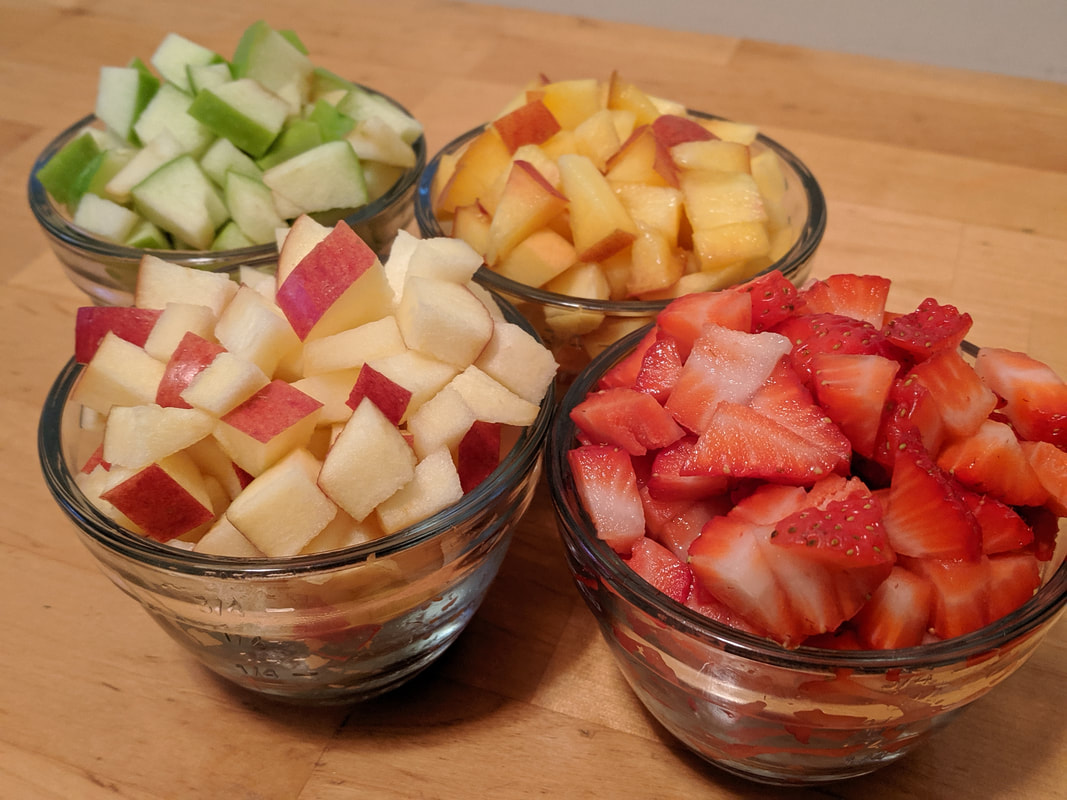 Chopped fruit: apples, strawberries, and peaches