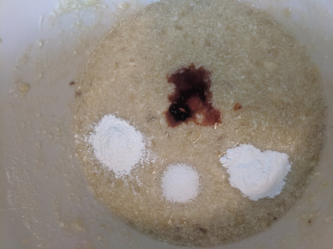 Adding vanilla, baking powder, baking sugar, and salt